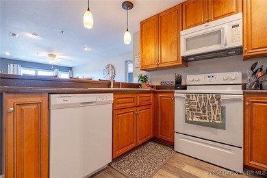 Welcome to this beautifully remodeled, walk-in end unit at The - photo 12