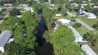 Own the land, skip the lot rent, and enjoy turnkey canal-front - photo 42