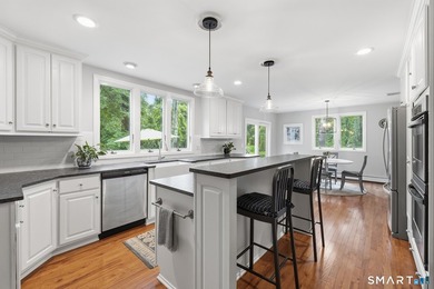 Centrally located yet private, this impeccably maintained - photo 4