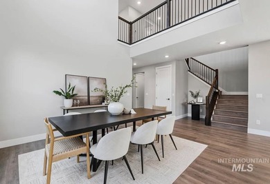 Set against the Eagle Foothills, this Shea Homes Symphony floor - photo 3