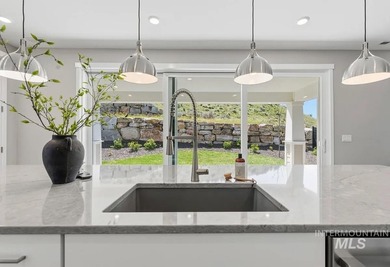 Set against the Eagle Foothills, this Shea Homes Symphony floor - photo 7
