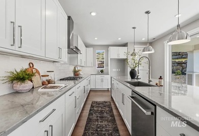 Set against the Eagle Foothills, this Shea Homes Symphony floor - photo 8