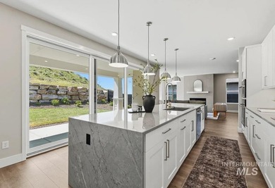 Set against the Eagle Foothills, this Shea Homes Symphony floor - photo 9