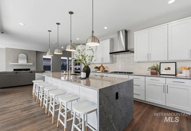 Set against the Eagle Foothills, this Shea Homes Symphony floor - photo 10