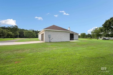 Nestled on nearly three acres of pristine land in Fairhope, this - photo 11