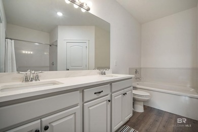 Nestled on nearly three acres of pristine land in Fairhope, this - photo 23