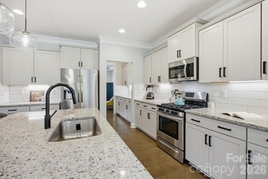 Welcome home to this beautifully upgraded 4-bedroom, 3-bathroom - photo 7
