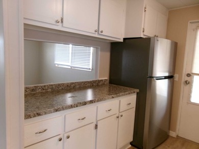 This home features 2 bedrooms, 2 bathrooms, a Florida Room for - photo 3