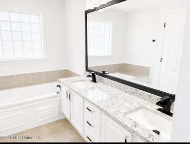 This beautifully updated 4-bedroom, 2-bath home is located in a - photo 12