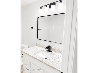 This beautifully updated 4-bedroom, 2-bath home is located in a - photo 20