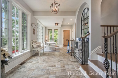 WITH OVER 400' OF PRIME SPRING LAKE WATER FRONTAGE SITS THIS - photo 44