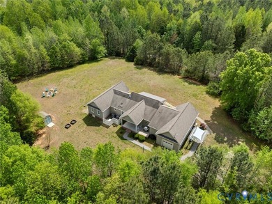 Custom-built and situated on 3.42 private wooded acres, this - photo 49