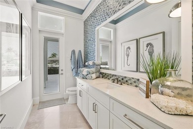 This coastal-inspired estate, built by Braun Builders, offers 5