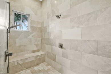 This coastal-inspired estate, built by Braun Builders, offers 5