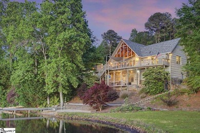 Set along more than 200 feet of water frontage, this exceptional - photo 1