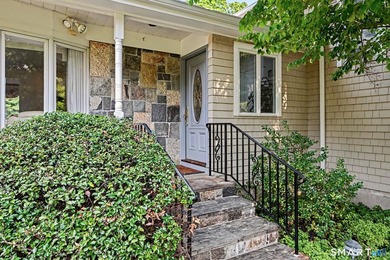 Tucked away on a quiet, tree-lined street in North Stamford - photo 2