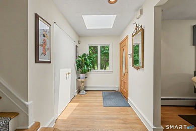 Tucked away on a quiet, tree-lined street in North Stamford - photo 3