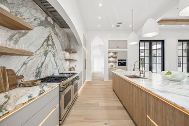 Discover refined coastal living in this stunning custom-designed - photo 12