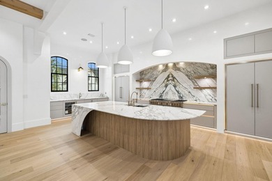 Discover refined coastal living in this stunning custom-designed - photo 34