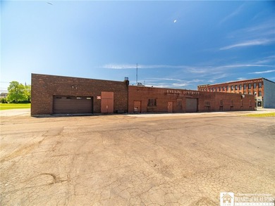 Large well maintained brick building with ample parking situated - photo 38