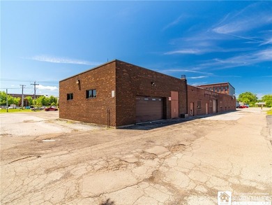 Large well maintained brick building with ample parking situated - photo 41