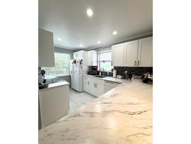 Nestled in the lush, gated Las Vistas community, this corner - photo 1