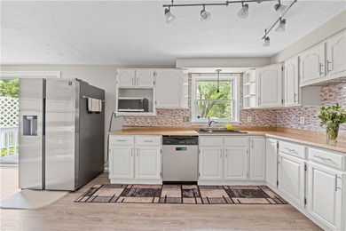 Updated 3 bedroom and 1.5 bath ranch offering the ease and - photo 5