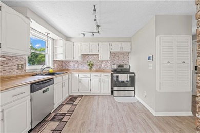 Updated 3 bedroom and 1.5 bath ranch offering the ease and - photo 6