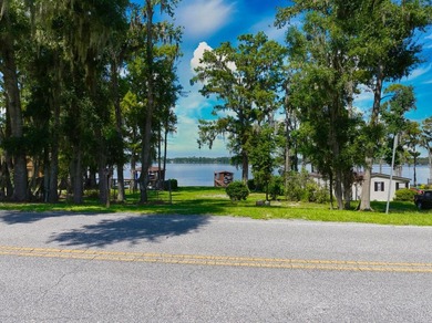 Discover a rare opportunity to own a prime waterfront lot on the - photo 2