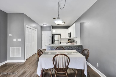 This desirable end-unit condominium offers a light-filled layout