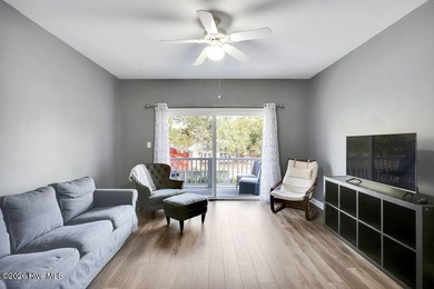 This desirable end-unit condominium offers a light-filled layout