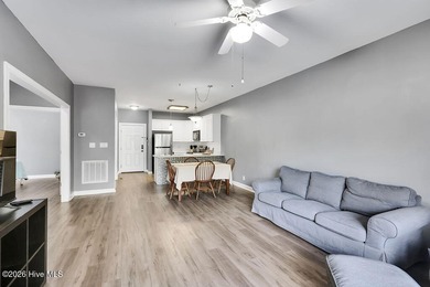 This desirable end-unit condominium offers a light-filled layout