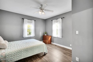 This desirable end-unit condominium offers a light-filled layout