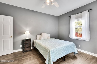 This desirable end-unit condominium offers a light-filled layout