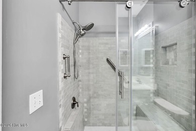 This desirable end-unit condominium offers a light-filled layout