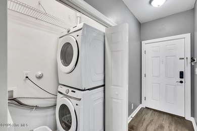 This desirable end-unit condominium offers a light-filled layout