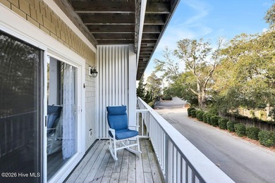 This desirable end-unit condominium offers a light-filled layout