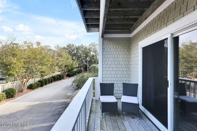 This desirable end-unit condominium offers a light-filled layout