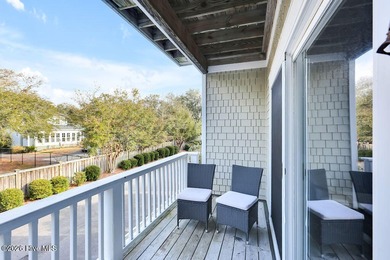 This desirable end-unit condominium offers a light-filled layout