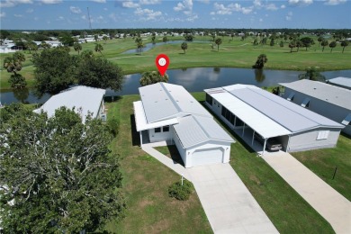 Lake Home For Sale in Barefoot Bay, Florida