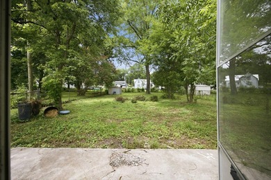 Large fenced in backyard, perfect for entertaining. Discover the - photo 19