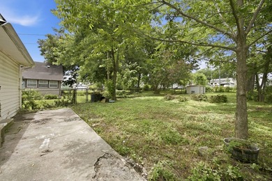 Large fenced in backyard, perfect for entertaining. Discover the - photo 20