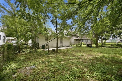 Large fenced in backyard, perfect for entertaining. Discover the - photo 21