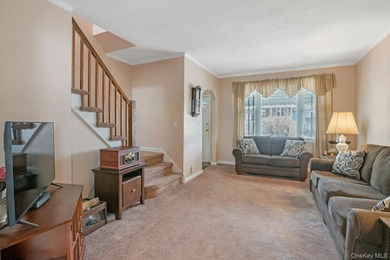 This well-maintained brick home offers a spacious and functional - photo 3