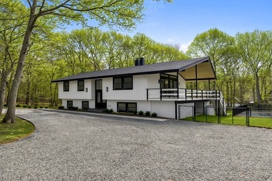 Tucked away on a full acre in the heart of Hampton Bays, this - photo 3