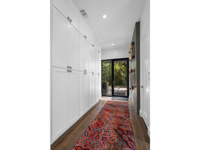 Nestled beneath a canopy of mature trees with sweeping views of - photo 4