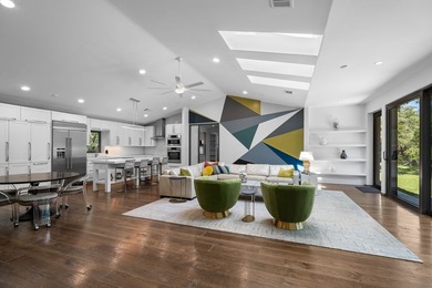 Nestled beneath a canopy of mature trees with sweeping views of - photo 5