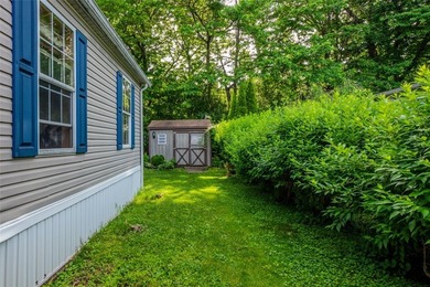 Welcome to the quiet Whispering Woods Estates community! First - photo 2