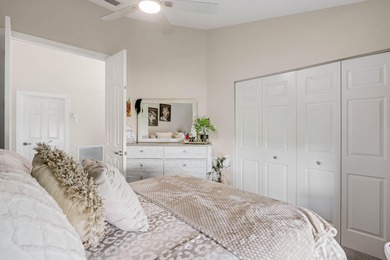 Nestled within a gated community, this spacious split-plan home