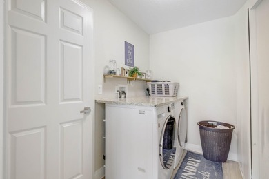 Nestled within a gated community, this spacious split-plan home